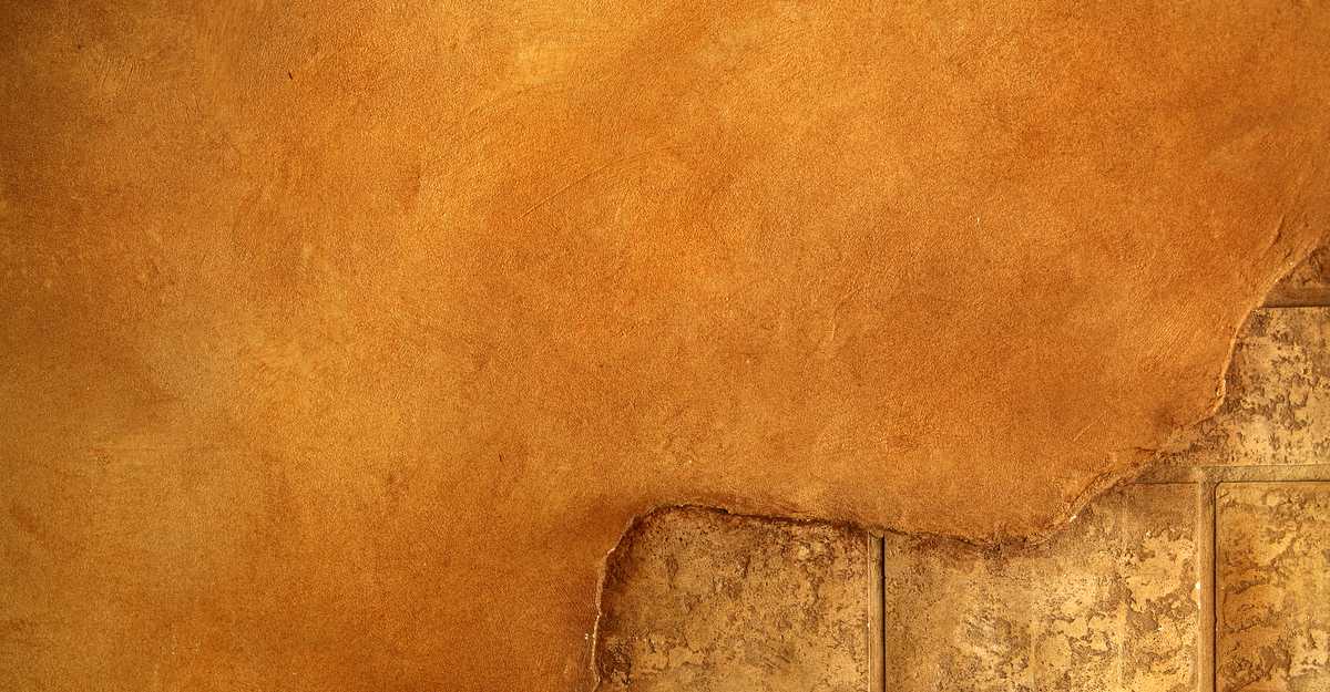 warm wall with bricks showing